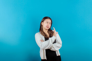 Concerned Asian woman showing rejection sign, saying no, raising awareness, standin