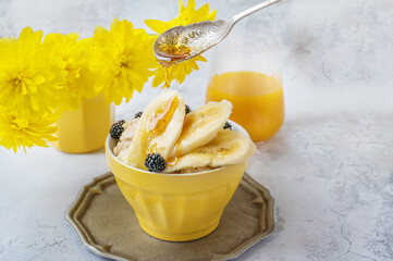 oatmeal for breakfast. A healthy breakfast of oatmeal, banana, blackberries and mulberries with...