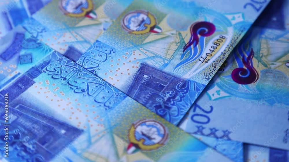 Poster camera panning 360 degrees around spread 20 kuwaiti dinar notes. camera moving around scattered dina