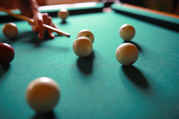Russian billiard balls, cue, triangle, chalk on a table Green cloth Copy space