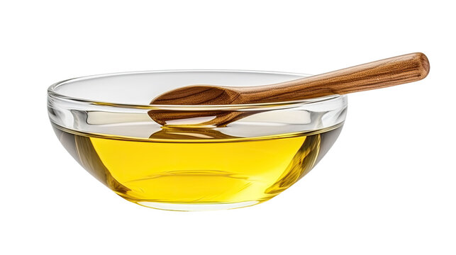 Vegetable cooking oil in glass bowl with wooden spoon isolated on transparent or white background 