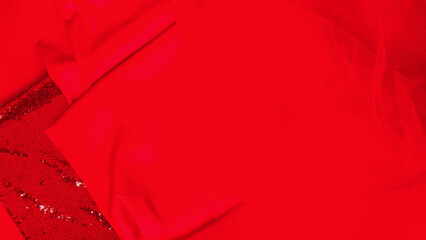 Fashion business. Collection of various red fabric on red background table, copy space. sewing...