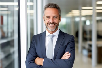 smiling mid aged business man executive standing in office, mature confident professional manager, confident businessman investor looking at camera, portrait - obrazy, fototapety, plakaty