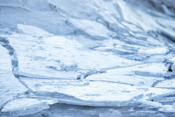 Broken ice shards lay on the coast of Baltic Sea