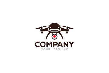Drone is a logo design of a flying drone with a big red dot in the center of the drone. 