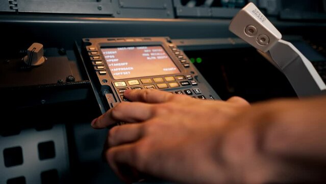close-up hand of the pilot captain presses the buttons on the control panel to start the engine of the plane Flight simulator close-up