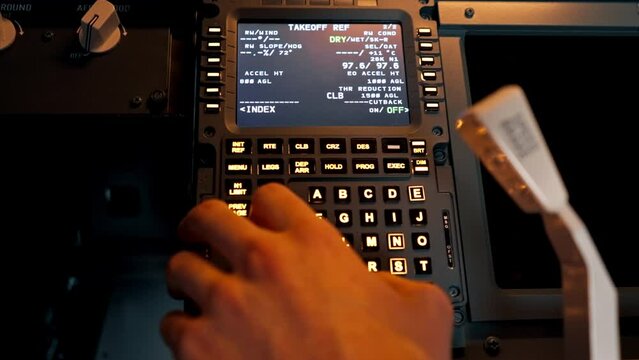 close-up hand of the pilot captain presses the buttons on the control panel to start the engine of the plane Flight simulator close-up