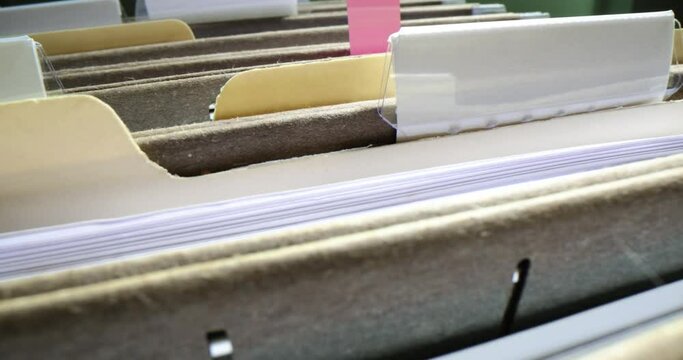 Folders with financial documents are placed in boxes