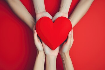 Red heart symbolizing mutual care and solidarity held by numerous hands