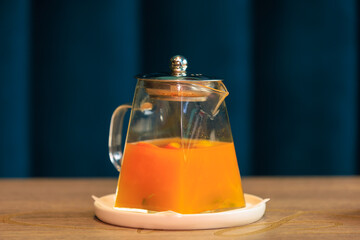 Teapot with fruit tea. Background with selective focus and copy space