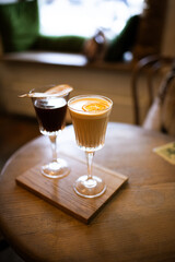 Two wineglasses with coffee and mulled wine 
