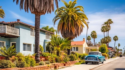 Fotobehang A picturesque street in a quaint California town featuring charming houses with a classic retro car adding a nostalgic touch to the scene. AI-generated image © Hanna Tor