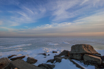 The Great South Bay frozen winter landscape at sunset. Depicting a beautiful winter scene and cold weather