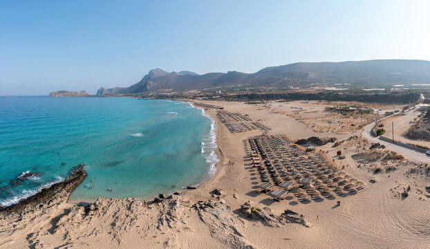Phalasarna sandy beach, Crete island Greece. Aerial drone view of wavy sea water, famous resort.