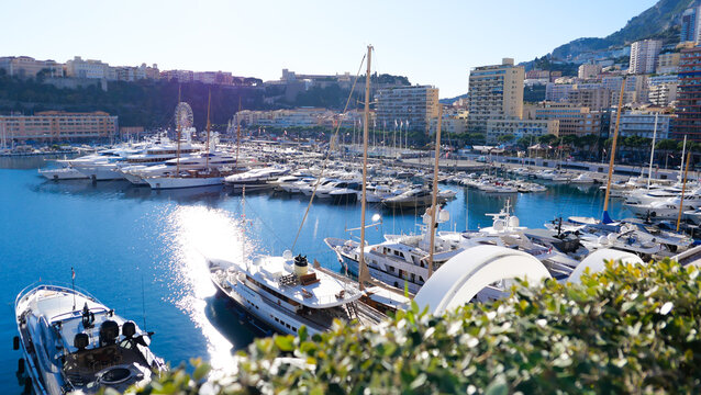 Monaco, France - December 17, 2023: The picturesque Port Hercule, Monaco, adorned with pristine white yachts at rest. A picturesque seaside that captures the luxury and elegance of Monaco's port.