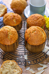 Sweet banana bread muffins with shredded coconut - 695087661
