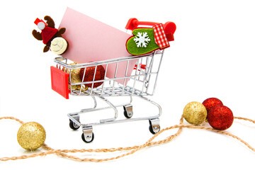 Blank greeting card with wooden decorative clothespins and Christmas tree toys in supermarket...