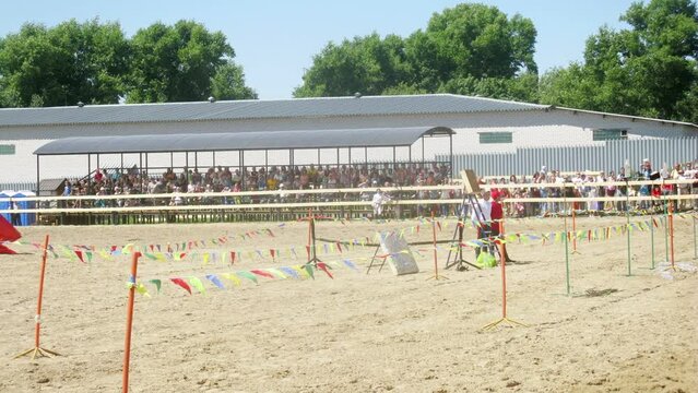 Horseman rides near tribunes at competitions on dgigitovka