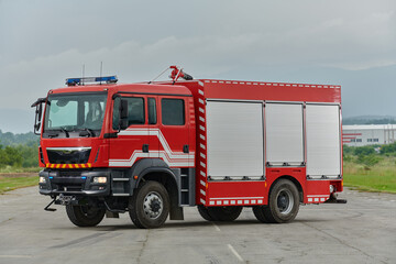 In this captivating scene, a state-of-the-art firetruck, equipped with advanced rescue technology, stands ready with its skilled firefighting team, prepared to intervene and respond rapidly to