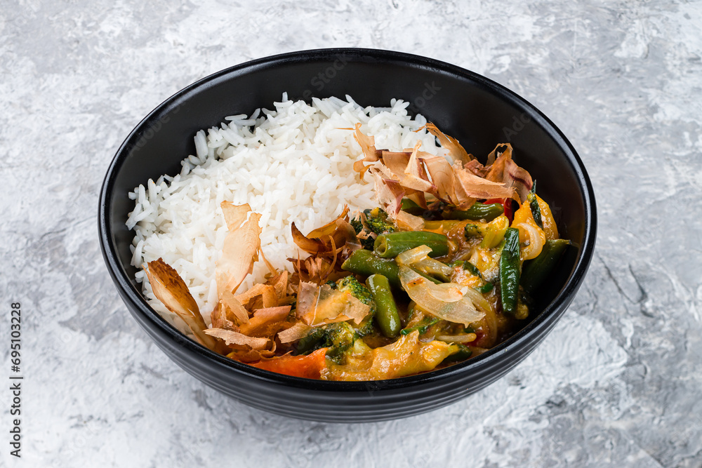 Wall mural boiled rice with stewed broccoli, green beans, tomatoes, onions, cheese and tuna shavings in a bowl.