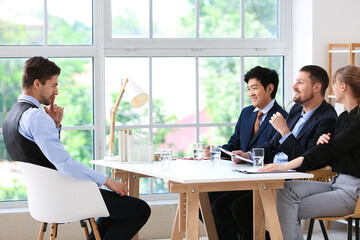 Human resources commission interviewing male applicant in office