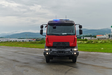 In this captivating scene, a state-of-the-art firetruck, equipped with advanced rescue technology, stands ready with its skilled firefighting team, prepared to intervene and respond rapidly to