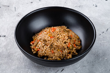 Fried rice with carrots, onions and soy sauce, fresh dinner.