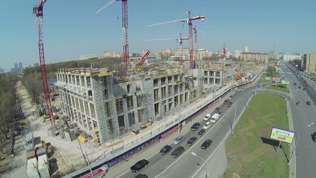 Transport ride by street near construction site of city block