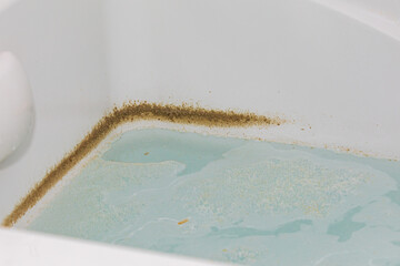 Whirlpool tub or jetted bathtub with dirty water. Household chores, bathroom cleaning and...