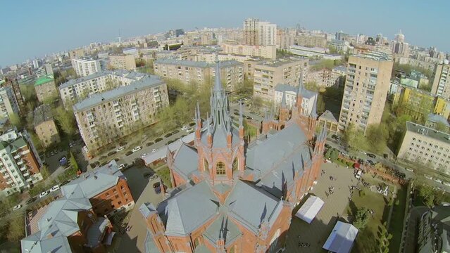 Cityscape near catholic cathedral at sunny spring day.