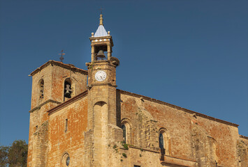 Fototapeta na wymiar Tall historic bell tower of an ancient church