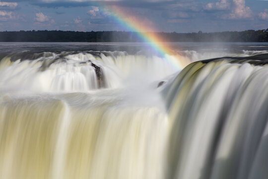 Waterfall details with rainbow at Devil's Throat at Iguazu Waterfalls in Brazil