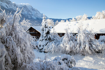 Fototapeta na wymiar wintertime in small german village covered with snow Garmish-Partenkirchen
