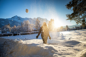 woman having fun in winter snow