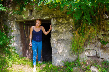 Young woman and old cellar in Nograd
