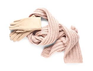 Gloves with warm scarf on white background