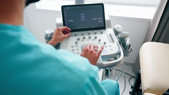 Close-up shot of an ultrasound diagnostic machine in medical center for scanning the state of the body