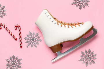 Ice skate with decorative snowflakes and candy canes on pink background - obrazy, fototapety, plakaty