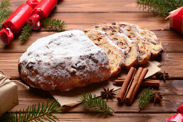 Composition with tasty Christmas stollen on wooden background