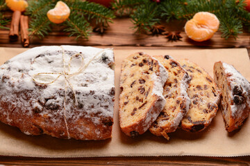 Fototapeta na wymiar Composition with tasty Christmas stollen on wooden background