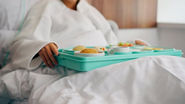 Close-up shot of a tray with healthy food for patient in hospital room in an inpatient medical center