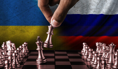 Russia vs Ukraine flag concept on chessboard. Political tension between Russia and Ukraine....