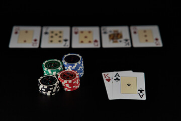 Dealer or croupier shuffles poker cards in a casino on the background of a table, chips. Concept of poker game, game business. Playing for money, a big win, a jackpot, gambling, a desire to get rich.	