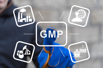 Worker or engineer using virtual touch screen presses abbreviation: GMP. Industry concept of GMP - Good Manufacturing Practice.