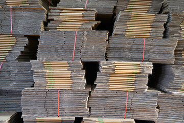 Stacks of cardboard boxes in a sweet potato packaging base in North China