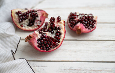 Fresh Opened Pomegranate on Light Colored Plate - 695129404