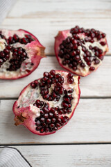 Fresh Opened Pomegranate on Light Colored Plate