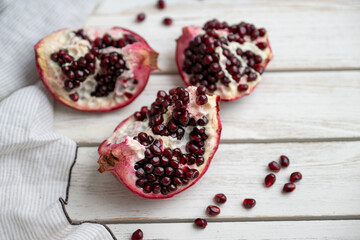 Fresh Opened Pomegranate on Light Colored Plate