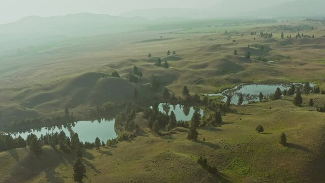 Aerial view of rolling plains with water landscape in Montana