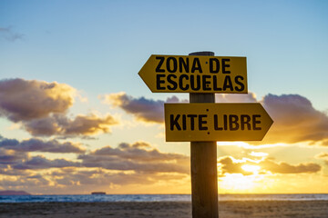 Sign in spanish at beach navigate surfing school and kitesurf